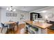 Open floor plan showcasing the kitchen island, dining area, and a peek of the living room at 7250 Hunters Branch Dr, Atlanta, GA 30328