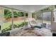 Bright sunroom with large windows, overlooking landscaped backyard, creating a serene and relaxing atmosphere at 7250 Hunters Branch Dr, Atlanta, GA 30328
