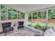 Bright sunroom with large windows offering views of the landscaped backyard, creating a relaxing retreat at 7250 Hunters Branch Dr, Atlanta, GA 30328