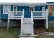 House exterior with raised deck and stairs to backyard at 110 Fox Meadow Dr, Covington, GA 30016