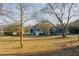 Large lawn and a blue house, complemented by a white porch, make this backyard ideal for outdoor living at 110 Fox Meadow Dr, Covington, GA 30016