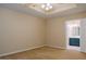 Bedroom features tray ceiling, fan and a doorway to the Primary bath at 110 Fox Meadow Dr, Covington, GA 30016