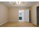 Bedroom features tray ceiling, fan and a doorway to the Primary bath at 110 Fox Meadow Dr, Covington, GA 30016