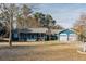 Charming blue single story home with a large yard and a two-car garage at 110 Fox Meadow Dr, Covington, GA 30016