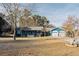 Charming blue single story home with a large yard and a two-car garage at 110 Fox Meadow Dr, Covington, GA 30016