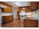 Traditional kitchen features granite counters, wood cabinets, and tiled backsplash at 110 Fox Meadow Dr, Covington, GA 30016