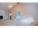 Spacious living room with vaulted ceiling and cozy fireplace feature at 110 Fox Meadow Dr, Covington, GA 30016