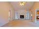 Bright living room featuring a fireplace and ample natural light at 110 Fox Meadow Dr, Covington, GA 30016