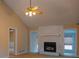 Open living room featuring a fireplace and vaulted ceilings at 110 Fox Meadow Dr, Covington, GA 30016