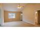 Inviting living room with natural light, carpet, and view of the front yard at 110 Fox Meadow Dr, Covington, GA 30016