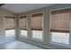 Sunroom with neutral walls and three windows at 110 Fox Meadow Dr, Covington, GA 30016