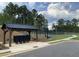 Community mailbox and covered area with a tennis court and basketball court nearby at 117 Oliver Dr, Locust Grove, GA 30248