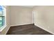 Bedroom featuring dark wood-look flooring and natural light at 117 Oliver Dr, Locust Grove, GA 30248