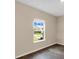 Bedroom featuring neutral walls, light trim, and window view at 117 Oliver Dr, Locust Grove, GA 30248