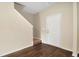 The entryway features hardwood floors, a white interior door, stairs to the left, and neutral-colored walls at 117 Oliver Dr, Locust Grove, GA 30248