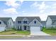 Charming two-story home featuring manicured lawn, stone accents, and attached two-car garage at 117 Oliver Dr, Locust Grove, GA 30248