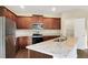 Kitchen features stainless steel appliances and granite countertops at 117 Oliver Dr, Locust Grove, GA 30248