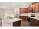 Stylish kitchen with granite countertops, stainless steel appliances, and rich wooden cabinetry at 117 Oliver Dr, Locust Grove, GA 30248