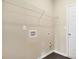 Functional laundry room with utility connections and built-in shelving for organized storage at 117 Oliver Dr, Locust Grove, GA 30248