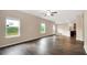 Open concept living area with wood-look floors and abundant natural light at 117 Oliver Dr, Locust Grove, GA 30248