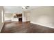Spacious living room and kitchen area with dark wood-look flooring at 117 Oliver Dr, Locust Grove, GA 30248