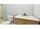 This half bath features a stone vanity and easy access to the glass shower at 1382 Elizabeth Ln, Atlanta, GA 30344