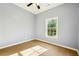 Bedroom with a ceiling fan, hardwood floors, natural light, and neutral gray walls at 1382 Elizabeth Ln, Atlanta, GA 30344