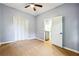 Bedroom with a ceiling fan, hardwood floors, closet, and entrance to the utility room at 1382 Elizabeth Ln, Atlanta, GA 30344