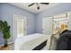 Cozy bedroom with patio access, ceiling fan, and ample natural light at 1382 Elizabeth Ln, Atlanta, GA 30344