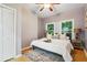 Charming bedroom with natural light, two windows and stylish decor at 1382 Elizabeth Ln, Atlanta, GA 30344