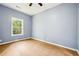Bedroom with a ceiling fan, hardwood floors, neutral walls, and natural lighting at 1382 Elizabeth Ln, Atlanta, GA 30344