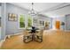Light-filled dining room features hardwood flooring, bright windows, and seating for four guests at 1382 Elizabeth Ln, Atlanta, GA 30344