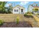 Charming two-story home with a welcoming front porch and beautifully landscaped front yard at 1382 Elizabeth Ln, Atlanta, GA 30344