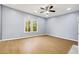 Bright living room with hardwood floors, fireplace, and large windows at 1382 Elizabeth Ln, Atlanta, GA 30344