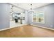 Inviting living room flowing into a white kitchen with stainless steel appliances at 1382 Elizabeth Ln, Atlanta, GA 30344