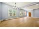 Open-concept living room featuring modern lighting and large windows at 1382 Elizabeth Ln, Atlanta, GA 30344
