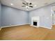 Cozy living room featuring a fireplace and ceiling fan at 1382 Elizabeth Ln, Atlanta, GA 30344