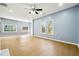 Bright living room with hardwood floors, a ceiling fan, recessed lighting, and large windows at 1382 Elizabeth Ln, Atlanta, GA 30344