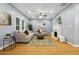 Living room features hardwood floors, a fireplace, ample natural light, and comfortable seating at 1382 Elizabeth Ln, Atlanta, GA 30344