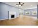 Spacious living room with a fireplace, hardwood floors, and natural lighting at 1382 Elizabeth Ln, Atlanta, GA 30344