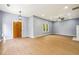 Large living room with hardwood floors and a rustic wooden front door at 1382 Elizabeth Ln, Atlanta, GA 30344