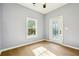Bright room featuring wood-look flooring, fresh paint, and a door to the outside at 1382 Elizabeth Ln, Atlanta, GA 30344