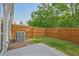 Fenced backyard featuring a small patch of grass and a patio at 2235 Mulsanne Dr, Lithonia, GA 30058