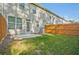 Spacious backyard featuring a grass lawn, small patio and a privacy fence at 2235 Mulsanne Dr, Lithonia, GA 30058
