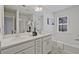 Bright bathroom featuring double vanity, bath tub, framed mirror, and bright finishings at 2235 Mulsanne Dr, Lithonia, GA 30058