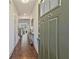 View into the house from the front door shows a long hallway with wood floors and natural light at 2235 Mulsanne Dr, Lithonia, GA 30058