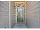 The front door and exterior of the home feature stone accents and updated fixtures at 2235 Mulsanne Dr, Lithonia, GA 30058