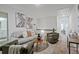 Inviting living room with a gray sofa, accent chairs, and stylish decor at 2235 Mulsanne Dr, Lithonia, GA 30058
