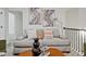 A gray sofa with decorative pillows and a coffee table, creating a cozy atmosphere at 2235 Mulsanne Dr, Lithonia, GA 30058