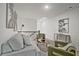 Inviting loft space with plush seating, stylish decor, and soft carpet at 2235 Mulsanne Dr, Lithonia, GA 30058